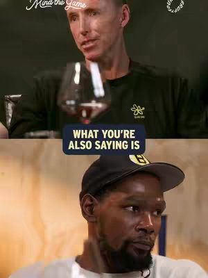 The cover image is a split-screen showcasing two individuals. The top half features a man holding a wine glass, set against a dark background, while below, another man is shown in a focused expression. An overlay text box with the phrase 'WHAT YOU'RE ALSO SAYING IS' appears between them.