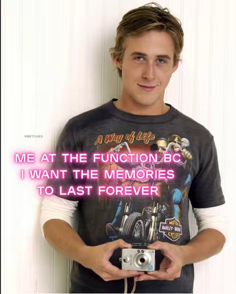 The cover image is a medium shot featuring a person holding a digital camera. The subject is a man with blonde hair, wearing a gray t-shirt with a motorcycle graphic. The overlay text is in pink and says 'ME AT THE FUNCTION BC, I WANT THE MEMORIES TO LAST FOREVER.' The background is a white panel. The lighting is soft, and the overall composition is well-lit, with focus on the man and the camera he is holding.