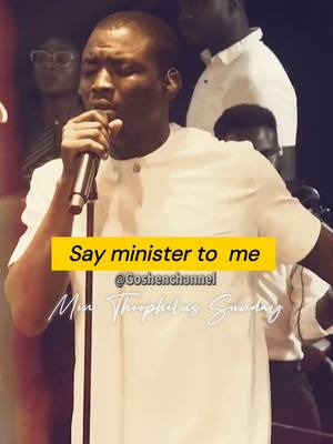 The cover image features a man holding a microphone and singing, centered in a mid-shot with blurred background figures. A yellow rectangular text overlay reads, 'Say minister to me.' The image has a warm, slightly desaturated color palette.