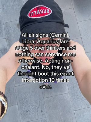 The cover image shows a woman holding the camera from a first-person perspective, looking down. She is wearing a black cap with a branded logo and visible text overlay. The face is partially visible. The background is a paved surface, and the overall composition is a selfie.
