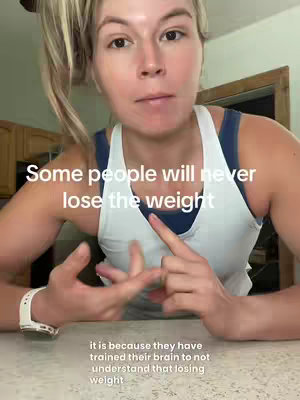 A woman is shown from the chest up, filling most of the frame. She's wearing a white tank top over a dark blue sports bra. Her blonde hair is partially pulled back in a loose ponytail. Text overlays the top of the image, and the lower portion.