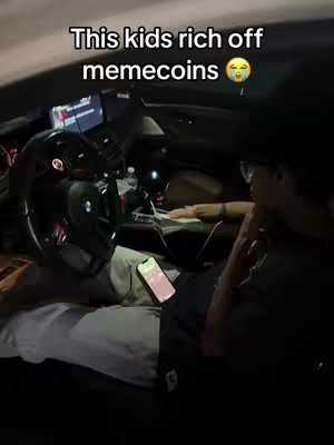 The image shows the interior of a car at night, with a person in the driver's seat and another person visible in the passenger seat. Text overlays the image.