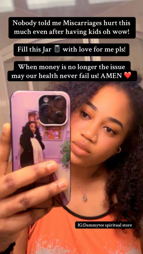 A woman with curly hair is holding her phone up. Text overlays are on the top of the frame in black rectangles. Her phone case has an image of a woman on it. The background is blurred.