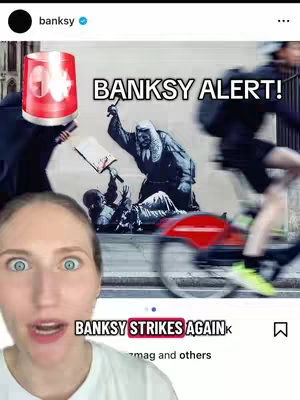 A woman smiles with wide eyes at the camera, with a Banksy artwork and a person riding a bicycle in the background. A red police light effect is over the woman's head. Text reading 'BANKSY strikes again' and the Instagram handle mark is in the bottom corners, with text over the woman's head reading 'BANKSY ALERT!'