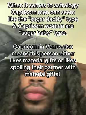 A selfie-style video with a man wearing a hooded sweatshirt and text overlay. The man has his mouth slightly open, and his face is the primary focus beneath the hood. The text above the man discusses astrology.