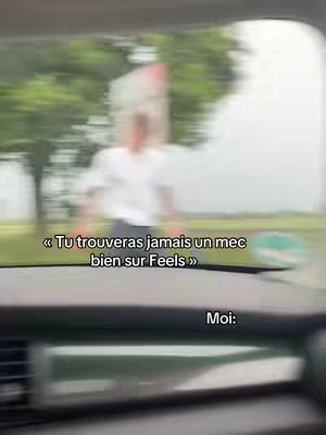 A blurred shot of a driver's perspective inside a car, with the road and a person outside the car also blurred. Overlaid text appears along the bottom and the top right.