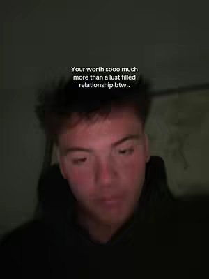 The cover image shows a young man in a close-up shot. His face has a slight flush, and his gaze is directed downwards. The background is dark, and there's text overlaid above his head.