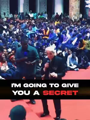 A cover image from a Christian religious event with a crowd of people. The main focus is on a man with white hair and a black suit, holding a microphone, presumably speaking to the multitude. Behind him, another man in a green shirt is also holding a microphone. A dark bar with white and red text is overlaid at the bottom of the image.