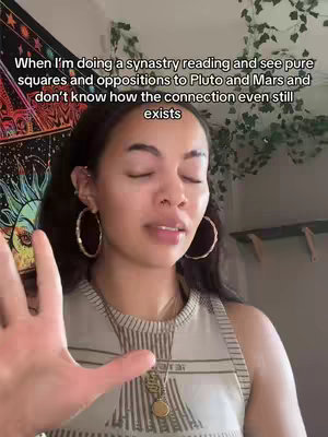A woman with dark hair wearing hoop earrings and a white top is shown close-up in a personal space. There is text overlayed on the image. The background includes what appears to be plant life and decor.