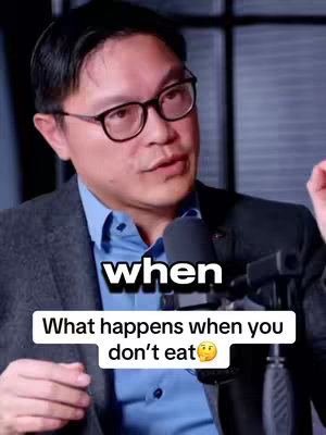 A man with glasses is seated in front of a microphone, looking toward the camera with a serious expression. Text overlays at the bottom read, 'when' in a bold font, and below that, 'What happens when you don't eat' with a thinking face emoji.