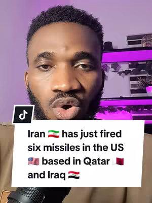 A close-up shot of a Black man with a surprised expression. He has short, dark hair and a trimmed beard. A white box with text about a missile incident is placed at the bottom of the frame. Above the text box and the creator is a Tik Tok and the background is blurred, but appears to have purple lighting. The image is well-lit with the man in focus.