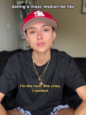 The cover image features a person with short hair, wearing a red baseball cap and black shirt. Text is overlaid, and the person has a slightly sad expression. The background is a blurred indoor setting.