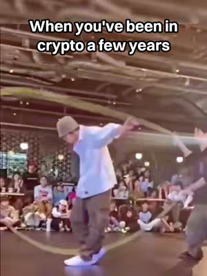 The cover image displays a man in a white shirt and brown pants dancing with what looks like a jump rope in a public place with a crowd in the background.