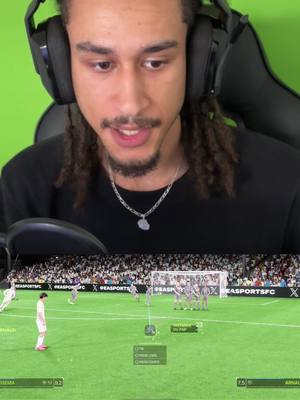 The cover image shows a man in the top half, wearing headphones and looking towards the viewer while speaking. Below this, the screen displays a game simulation. The image is split horizontally by the creator's face on top and a video game within the bottom half.