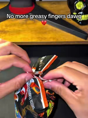 The image shows hands opening a bag of chips. The focus is on the hands, bag, and a hook text overlay.