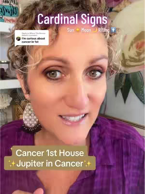A light-skinned woman with curly brown hair smiles at the camera. She wears a shimmery earring on her left ear, eye makeup, and a purple shirt. Text overlays include astrological information and a comment from "Where The Breeze Blows"