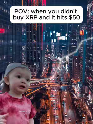 A baby in a pink t-shirt and a gray cap stands in front of a cityscape with a financial chart overlay and the text 'POV: when you didn't buy XRP and it hits $50'.
