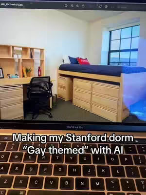 A laptop screen displays a college dorm room, furnished with a desk, bed, and window. Overlayed on the screen's image are words in a rectangular box, and the keyboard is visible below.
