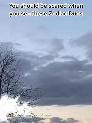 The image shows a cloudy sky with bare tree branches in the foreground. Text is overlaid at the top, containing a message.