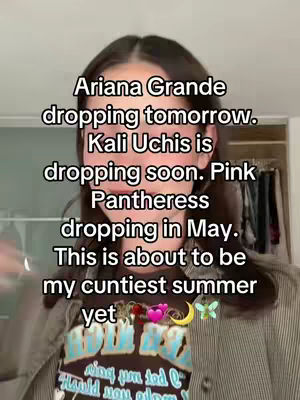 A selfie-style video cover with the creator in the center. Text overlays state the names of artists with release dates. The overall composition features the creator's face in the foreground.