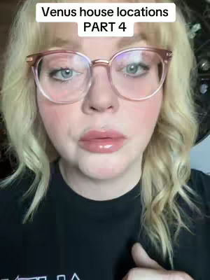 A close-up shot of a woman with blonde hair wearing glasses and a black shirt. The image is well-lit, with a focus on her face. The text overlay is in a white rectangular box.