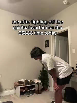 The cover image shows a person, likely the creator, in a room, bent forward as if exhausted. Text overlayed on the image communicates the context of the video content. The layout is simple with a focus on the creator and the overlaid text, with a neutral-colored background, and a small Christmas tree can be seen in the back.