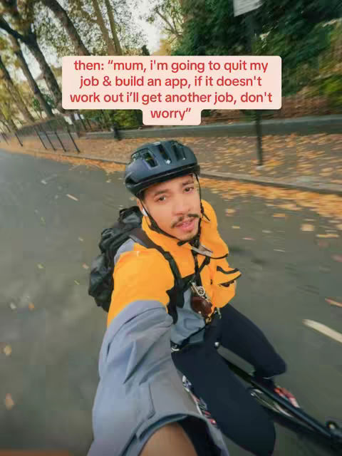 The cover image shows a selfie-style shot of a man riding a bike on a road. The background consists of trees and foliage, suggesting an outdoor setting. The man is wearing a helmet and a bright yellow and gray jacket, the overall composition is dynamic due to the perspective of the moving bike.