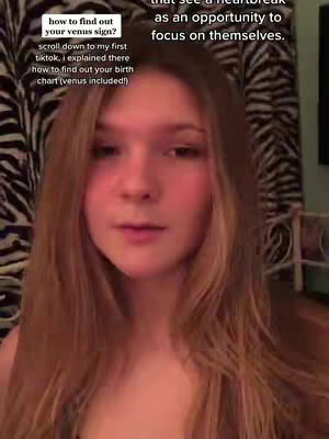 A selfie-style video with a young woman in the frame. The background is a black and white zebra print. The text overlay is contained in a white box in the top left. The woman has long blonde hair and she is looking towards the camera. The background is dark, setting the protagonist in the foreground.