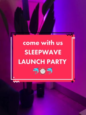A vertical image with a red background. A white box with black borders takes up most of the screen, with the text 'come with us,' 'SLEEPWAVE,' and 'LAUNCH PARTY' in white, stylized fonts. Below the text, there are two blue dolphin emojis on either side of a clock emoji. In the background is a plant, and the walls are lit by purple neon light.
