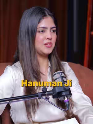 The cover image features a woman in a studio setting, likely for a podcast or interview. She is positioned slightly off-center, looking towards the left. A microphone is positioned in front of her face. The text overlay uses yellow color, contrasting with her skin tone and the background.