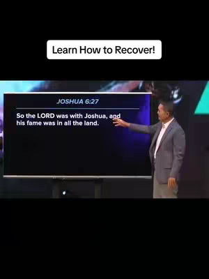 A man in a gray suit jacket stands beside a large screen displaying text, indicating a presentation or lecture setting, with the text 'Learn How to Recover!' in a white box overlayed at the upper margin of the screen.