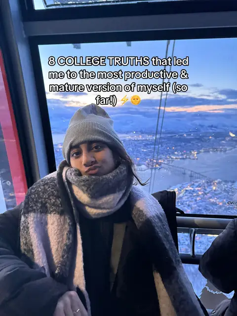 The cover image shows a young woman in a cable car with a snowy mountain view in the background. She wears a gray beanie and a patterned scarf, looking towards the camera with a slight pout. The sky is cloudy, and text overlays at the top read "8 COLLEGE TRUTHS".