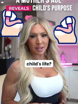 A woman with long blonde hair is the central focus of the image, set against a blurred background of a kitchen. She is looking directly at the camera with a slight smile. Above her head, the text "A Mother's Age Reveals Child's Purpose" is displayed in a pink and white banner. To each side of her head are illustrated images of a pregnant belly. A white oval displays the text overlay "child's life?" below her chin, possibly asking a question related to the content. The overall composition suggests a video about parenting or astrology, using a personalized setting to engage the audience.