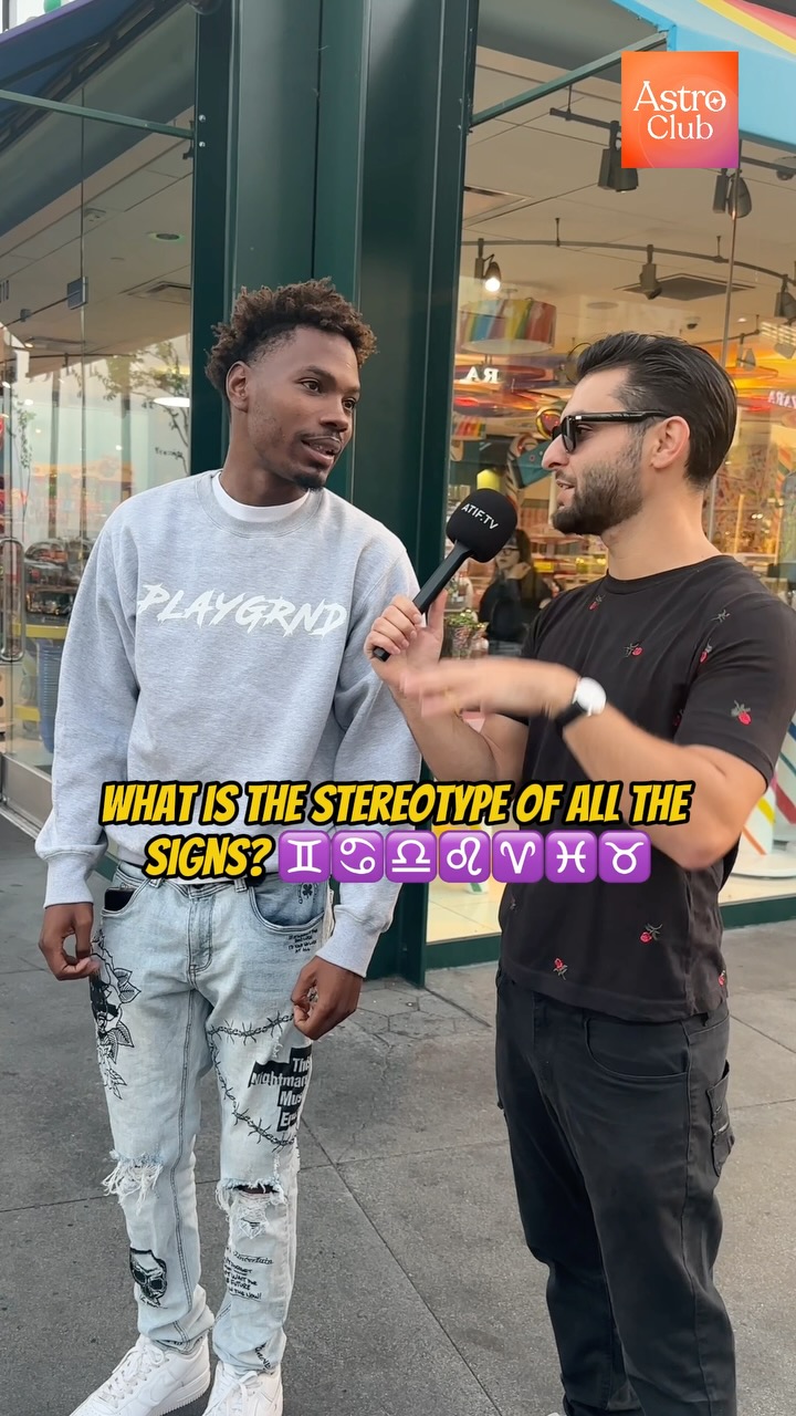 Two men standing on a city street, one interviewing the other. The interviewer is holding a microphone. Text overlays on the image ask a question. The background includes a store front, street, and other surroundings.