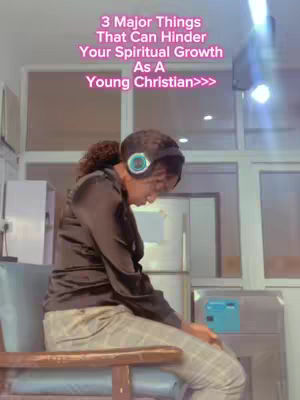 The cover image shows a person wearing headphones, seated with their head bowed. Overlayed text in pink highlights the topic: "3 Major Things That Can Hinder Your Spiritual Growth As A Young Christian>>>". The scene is in a room with windows.