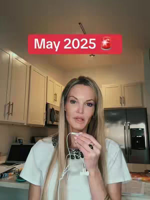 A woman stands in a kitchen setting, holding white earbuds, with a red banner overlay that reads 'May 2025' and a graphic.