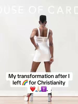 A person stands with their back to the camera, hands on their hips, in a white dress and high heels. The background has white walls and a neon sign that says "HOUSE OF CARDS". A text overlay at the bottom says, "My transformation after I  left [rainbow] for Christianity [heart] [praying hands] [cross]."