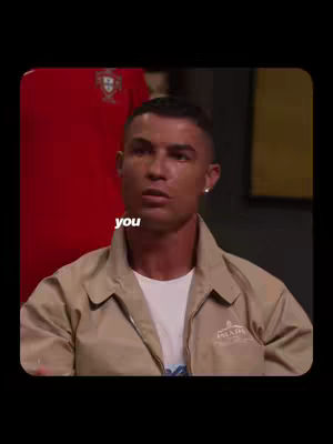 The cover image showcases Cristiano Ronaldo in a medium shot, looking directly at the viewer with a contemplative expression. He wears a light brown jacket over a white shirt, and a small earring in his left ear is visible. The background includes a hint of a red item and a dark, indistinct interior. The text overlay 'You' appears in white, positioned to the left of Ronaldo, drawing focus to his face.