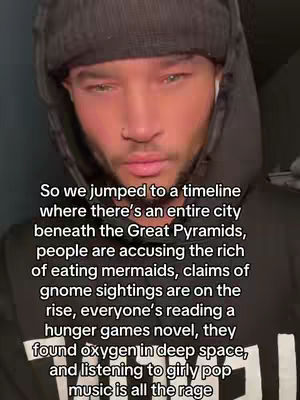 A man with a beard, wearing a black hoodie and a beanie is looking at the camera. Text is overlaid on the image.