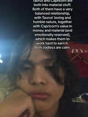 A medium shot shows a person in a casual setting, probably indoors, with the person's face taking up most of the frame. The person seems to be deep in thought, their hand supporting their head near their temple. Overlayed text presents a text analysis of the zodiac signs Taurus and Capricorn.