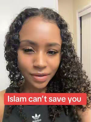 A close-up shot features a woman with curly dark hair, looking towards the camera with a neutral expression. A red rectangular banner with white text, 'Islam can't save you,' is placed over her chest.