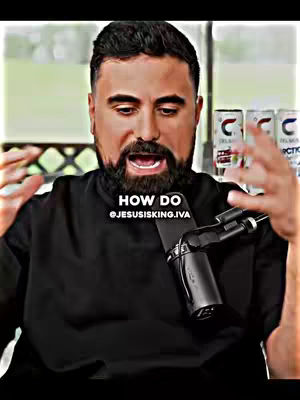 A man with a dark beard and a black shirt is speaking into a microphone. Text is overlaid on the bottom that says 'HOW DO @JESUSISKING.IVA'. Behind him there are items on a shelf.