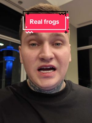 A man with short, light-brown hair looks directly at the camera. He has a tattoo on his neck and is wearing a black shirt. A rectangular overlay with the text "Real frogs" is positioned above his head.