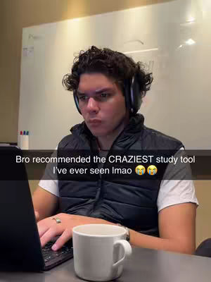 A young man with dark curly hair and headphones is seated in front of a laptop, making a quizzical face. Text overlay is visible at the bottom with playful emojis.
