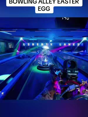 The cover image shows a first-person perspective of a video game scene inside a bowling alley. The alley is lit with neon blue and purple lights, and the word "LIBERTY LANES" is visible above the lanes. In the middle of the bowling lanes is an object that looks like a futuristic flower that is glowing. The camera is holding a gun, and the video is of a game play.