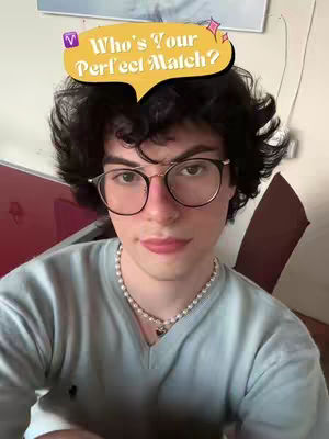 A selfie of a person with curly dark hair, wearing glasses and a light blue shirt. The person has a bubble overlay that says, "Who's Your Perfect Match?"