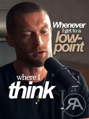 The cover image shows a close-up of a man with short hair, looking slightly down with a serious expression. Above and below him are overlaid text elements, and he's holding a microphone.