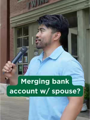 A man holding a microphone on the street, with text overlayed. The background is a building with a green awning and a brick facade.