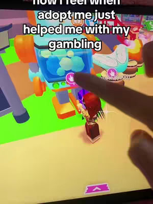 A screenshot from a mobile game, showing a colorful, cartoonish scene with a robot-like structure. A finger is interacting with the screen.