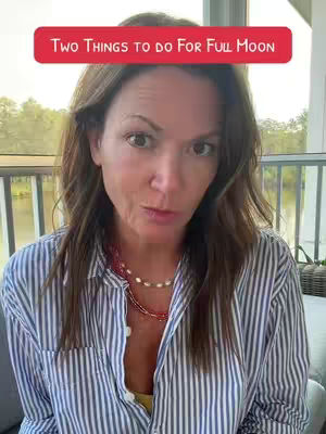 A woman with medium-length brown hair is centered in the frame, facing the camera, with an expression of mild surprise. She wears a vertically striped button-down shirt and a delicate necklace, against a blurred outdoor background that suggests a balcony or patio setting. A red banner at the top reads, 'Two Things to Do for Full Moon.'